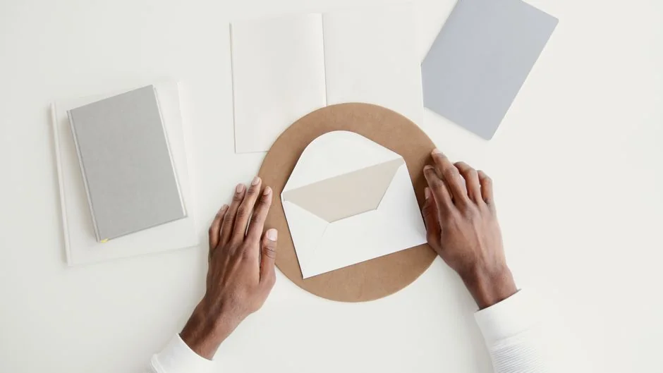 Planner open on a desk with handwritten Holiday Email Marketing Series note.